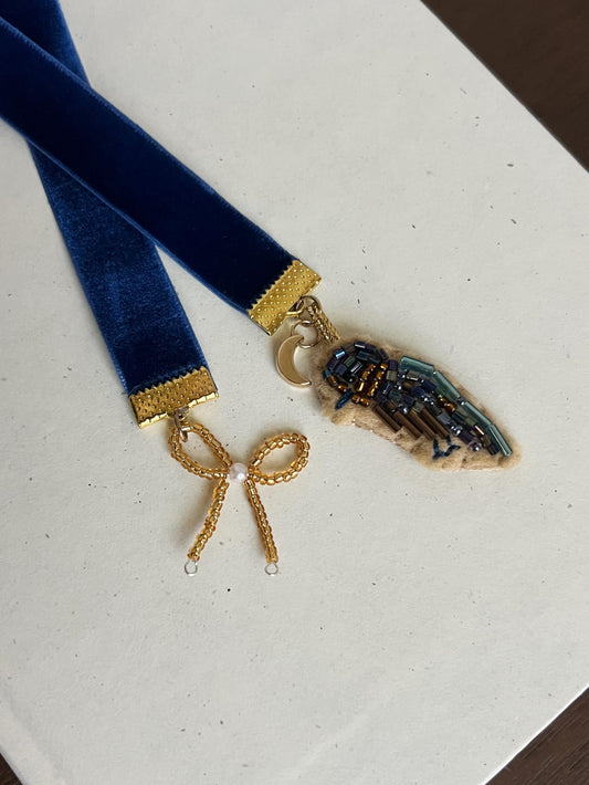 The Dressmaker embroidered bookmark
